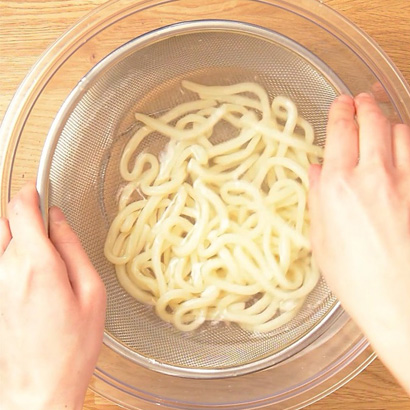 Run them under cold water and then drain them.